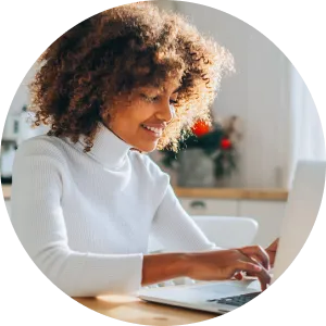 a woman typing on a laptop computer