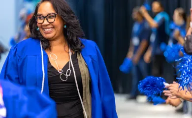 A UMA graduate at a UMA Commencement ceremony.