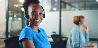 A healthcare professional smiles while working