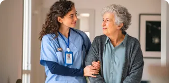 A healthcare professional assists a patient