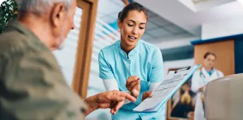 A healthcare professional attends to a patient