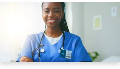 a medical assistant smiling after completing a clinical medical assistant program