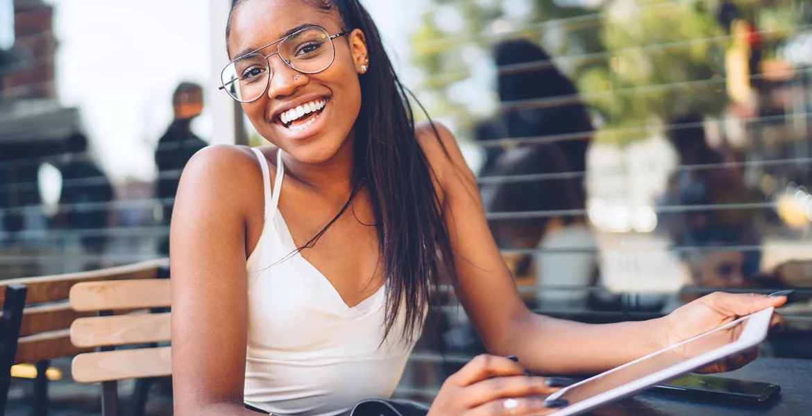 woman wearing glasses smiling