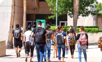 A group of students gathering on a school campus