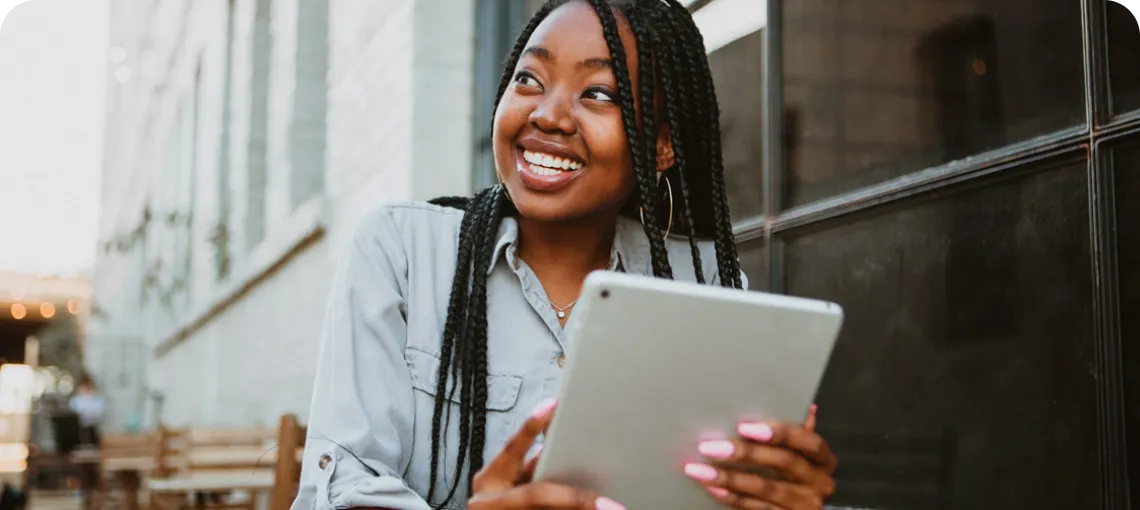 lady holding ipad studying