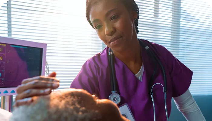 a nursing assistant taking care of patient