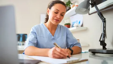 A healthcare professional working at a desk