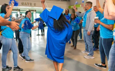 A UMA graduate celebrates at a UMA Commencement ceremony.